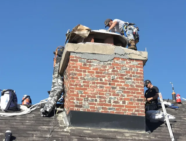 Doral Chimney Sweep installing a custom chimney crown in Doral, FL